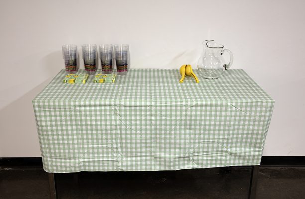 Kristen McBride and Jim Mann, "When life gives you lemons, make lemonade", performance with lemonade mix, water, glass jug, table, tablecloths, sugar, 2023.