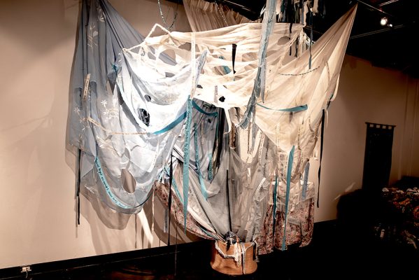 Megan Ali, Prabhleen Cheema, Dove Johnson, Samira Zreick,
Unravelling in Isolation, 
2025,
Fabric, ribbon, thread, clothing,
6.5’ x 9.6’ x 5’